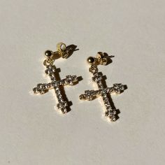 The Vatican CZ Cross Earrings are the perfect combination of elegance & simplicity. Inspired by Old World European style, these earrings make a statement with their religious CZ cross design. Add a touch of sophistication to any outfit with the beautifully crafted Vatican CZ Cross Earrings. Product Details: 30mm Gold-Filled CZ Cross Earrings Butterfly Closure Not Water-Wearable Made in Scottsdale, AZ Old World European, Earrings Butterfly, The Vatican, Gold Gift, Cross Design, Hand Chain, Waist Chain, Cross Earrings, Scottsdale Az