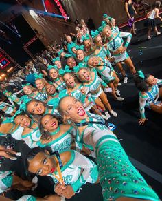 a group of cheerleaders are posing for the camera