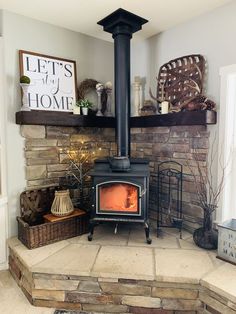 a wood burning stove sitting inside of a living room