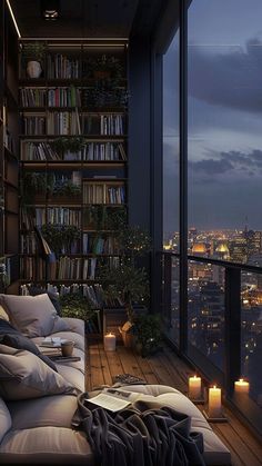 a living room filled with lots of furniture and bookshelves next to a window