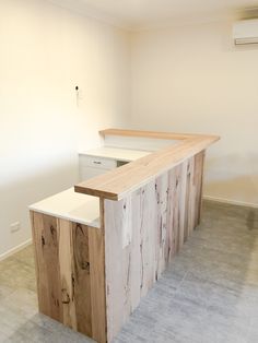 an empty room with a wooden counter top