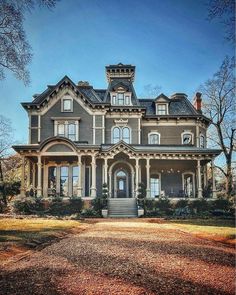 an old house with many windows and stairs