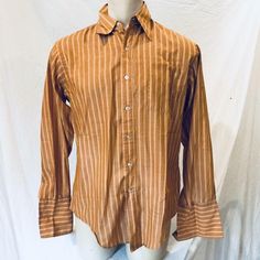 Vintage University Shop Mens Button Down Cotton Polyester Blend Shirt Size 16   ­in good used condition, no damage measures 22" from armpit to armpit , 18" across the shoulders, and 29" from shoulder to hem     fff     Pictures sell! Auctiva offers Free Image Hosting and Editing. The complete eBay Selling Solution. Retro Formal Cotton Tops, Vintage Formal Shirt With Button Closure, Formal Brown Cotton Top, Brown Cotton Formal Tops, Brown Cotton Shirt With Button Cuffs, Vintage Long Sleeve Business Shirt, Vintage Fitted Business Shirt, Vintage Brown Shirt For Workwear, Vintage Striped Cotton Shirt