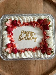 a happy birthday cake with strawberries on it