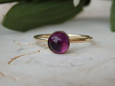 Amethyst Ring, Purple Amethyst Ring, Gold Filled Ring,Circle Ring, February Birthstone.Purple Stone Ring. Midi Ring. Little Ring.petite ring Rebeka Jewelry is a brand of Jewelry designs with high quality materials. Each one of jewels is made out of a thinking process, taking into account each detail to the last. In each one of my jewels you will feel the love our put into and the love for our profession. Details of ring: Metals:14K gold filled Gemstone:amethyst Stone size: 6 mm Available all siz Round Cabochon Amethyst Ring, Purple Solitaire Round Ring, Purple Round Birthstone Ring, Wedding Ruby Ring With Cabochon, Dainty Amethyst Gemstone Ring, Dainty Round Amethyst Ring, Round Purple Birthstone Ring Gift, Purple Round Birthstone Ring Gift, Elegant Purple Stackable Rings