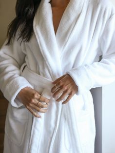 Elevate your post-bath experience with our Luxe Bath Robe, the epitome of comfort and sophistication. Crafted from a luxurious blend of cotton and bamboo viscose using cutting-edge Zero Twist technology, this robe envelops you in unmatched softness and indulgence. With an adjustable tie waist and spacious front-facing pockets, our lightweight robe offers functionality and style, making it the perfect addition to your daily routine. White Bath Robe Aesthetic, Bath Robe Aesthetic, Campground Resort, White Bathrobe, Bath Wrap, Earth Gift, Oprahs Favorite Things, Inappropriate Thoughts, College Essentials