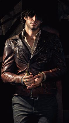 a man wearing a leather jacket and white shirt