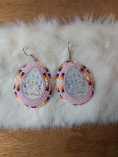 Beaded earrings! Very pretty. Would make a great gift Pow Wow Earrings, Elegant Beaded Earrings With Oval Beads, Beaded Teardrop Jewelry For Party, Pink Beaded Teardrop Jewelry, Handmade Pink Teardrop Crystal Earrings, Pink Teardrop Beaded Jewelry, Beaded Teardrop Jewelry For Gifts, Unique Beaded Teardrop Jewelry, Teardrop Earrings Gift