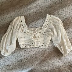 Nwot Tried On, But Never Worn. Size Small. Cream Color. String Tie. White Long Sleeve Bohemian Crop Top, Elegant White Crop Top For Vacation, Elegant White Crop Top For Beach, White Long Sleeve Crop Top For Vacation, White Bohemian Crop Top For Spring, White Feminine Crop Top For Vacation, White Bohemian Crop Top For Brunch, Shoulder Crop Top, Cream White