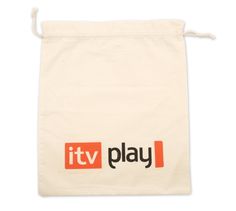 it's tv play logo printed on a canvas drawstring bag with orange and black letters