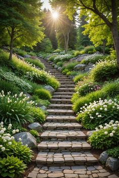 a stone path surrounded by trees and flowers