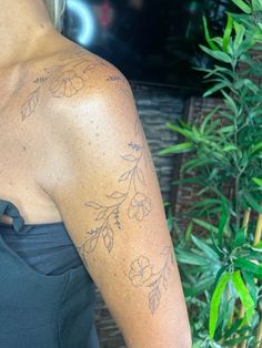 a woman with a tattoo on her arm