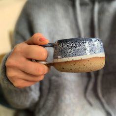 a person holding a cup with something in it