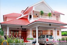 a car parked in front of a two story house with red roof and white trim