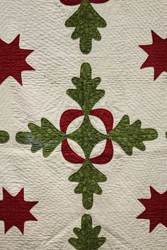 a quilted christmas tree with red and green stars