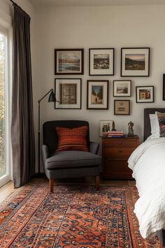 a bed room with a neatly made bed and lots of framed pictures on the wall