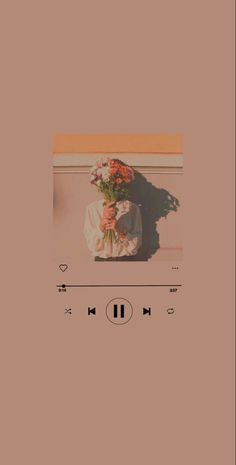 an audio player with flowers on top of it and the music player in front of it