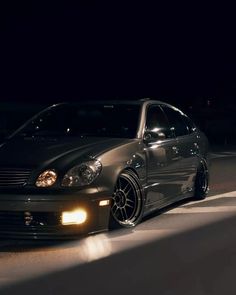 a car parked on the street at night