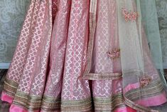 Be a vision of elegance and style in this beautiful blush pink chanderi silk embroidered lehenga at weddings and special occasions. It comes with a pastel green net dupatta. Shop online at Pure Elegance or visit our store in USA! Please refer to the picture for blouse measurement - Disclaimer: The actual product may vary slightly from the image. These are custom orders, hence expect slight variation in color, placement of the motif or buta. ESTIMATED DELIVERYBecause this is a custom order, it wo Pink Anarkali Set With Sheer Dupatta In Art Silk, Pink Anarkali Set With Chikankari Embroidery For Reception, Pink Tissue Silk Choli With Sheer Dupatta, Semi-stitched Pink Tissue Silk Lehenga, Pink Chanderi Sharara For Reception, Pink Tissue Silk Floor-length Sharara, Pink Floor-length Tissue Silk Sharara, Pink Chanderi Choli For Wedding, Wedding Pink Chanderi Choli