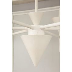 a white light fixture hanging from the ceiling