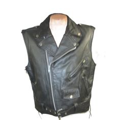 What you are looking at is a Vintage Mens First Black Leather Sleeveless Side Lace Motorcycle Jacket from circa 1990. It is sized men's U.S. Size 48 or a Size X Large. You can let the laces out to make it larger.It fits just like a standard motorcycle jacket just without the sleeves. Great jacket for summer riding or wearing old school biker style over an old beat up Levis jacket. The arm pit to arm pit measurement-is 24 inches. the length of the jacket is 26 measured from the top of collar to the bottom hem of jacket. Condition: Nicely Broken in. Edgy Vest For Biker Events In Fall, Punk Sleeveless Outerwear For Streetwear, Rocker Style Fitted Vest For Streetwear, Fitted Sleeveless Biker Jacket For Biker Events, Fitted Sleeveless Biker Jacket For Events, Fitted Punk Vest For Biker Events, Punk Style Fitted Vest For Biker Events, Casual Sleeveless Vest For Biker Events, Punk Style Vest Outerwear For Fall