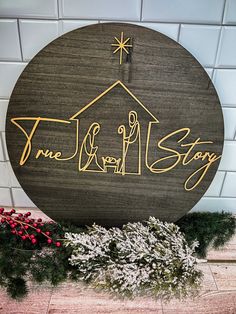 a wooden sign that says, one family story with the nativity scene on it