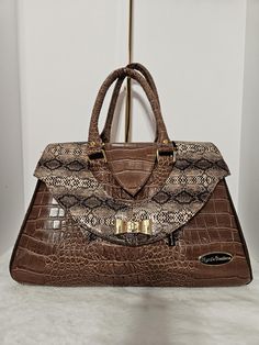 Handmade large shoulder bag, handcrafted in brown croc faux leather with snakeskin faux leather accents. Waterproof canvas lining for ease of use with a zipper pocket, slip pocket and a key fob. Front double elegant flaps and two zipper pockets underneath and another zipper pocket on back. This bag can be made to order in different colors.  Please allow 5 to 6 days for construction. Brown Crocodile Pattern Travel Shoulder Bag, Brown Crocodile Pattern Shoulder Bag With Double Handle, Brown Leather Satchel With Crocodile Pattern, Brown Crocodile Pattern Top Handle Satchel, Brown Crocodile Pattern Shoulder Satchel, Brown Crocodile Pattern Satchel For Daily Use, Brown Crocodile Pattern Satchel Shoulder Bag, Brown Leather Shoulder Bag With Crocodile Pattern, Brown Crocodile Pattern Crossbody Satchel