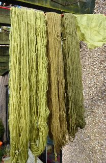 some green yarn hanging from a clothes line