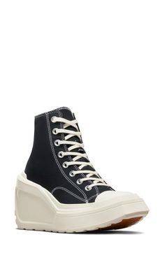 "Find CONVERSE Chuck 70 De Luxe High Top Wedge Sneaker on Editorialist. A lightweight wedge heel and platform boost this fierce rewrite of an iconic high-top sneaker outfitted with a canvas upper and lug sole for durability. 4 1/2\" heel; 2\" platform (size 8.5) 3 3/4\" shaft Lace-up style Textile upper and lining/rubber sole Imported" High Top Sneaker Outfit, High Top Wedge Sneakers, Black Wedge Sneakers, Converse Chuck 70, Chuck 70, Sneakers Outfit, Lug Sole, Converse Chuck, Wedge Sneaker