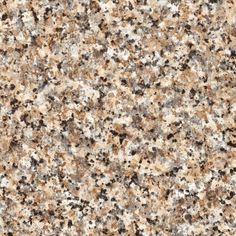 an image of a granite counter top with brown and black speckles on it