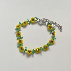 "Handmade Beaded Bracelet 🌻 I also have a matching necklace available ✿ Made with glass seed beads, glass crystal beads, and metal accents ✿ Green, yellow, and multicolored/oil-slick ✿ 6.75 - 7.25\" (slightly stretchy) plus 2\" of extension chain" Adjustable Yellow Beaded Bracelets With Beaded Chain, Yellow Czech Glass Bracelets With Round Beads, Adjustable Yellow Beaded Bracelet, Adjustable Yellow Beaded Chain Bracelets, Yellow Beaded Czech Glass Bracelets, Green Beaded Flower Crystal Bracelet, Yellow Beaded Chain Bracelet, Yellow Beaded Chain Bracelets, Adjustable Beaded Yellow Crystal Bracelet