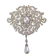 925 silver moissanite Queen Mary's Richmond brooch, Queen Elizabeth ii pearl brooch, princess brooch Metal: Sterling Silver Metal Purity: 925 Metal Weight: 15.51 Grams Stone Type: moissanite  Stone Color: white Stone Clarity: SI1-SI2 Stone Shape: Round  Stone Weight: 8.30 Ctw Stone: Pearl Gemstone weight: 4.00 cwt. Length: 7.5 cm Width: 5.9 cm Product Color: Oxidized Black and Gold Rhodium Plated on Sterling Silver > All products are made at our factory. so; you get the finest jewelry at factory Exquisite Brooches For Wedding, Exquisite White Wedding Brooches, White Diamond Wedding Brooches, Ornate White Gold Brooches For Wedding, Ornate White Gold Wedding Brooches, Victorian Style Wedding Brooch Pendant, Victorian Pendant Brooch For Wedding, Victorian Pendant Brooches For Wedding, Exquisite Silver Brooches As Gift