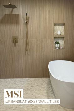 a large white bath tub sitting in a bathroom next to a walk - in shower