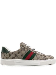 beige panelled design GG Supreme canvas signature Web detailing contrasting branded heel counter round toe front lace-up fastening branded leather insole flat rubber sole This piece comes complete with a protective dust bag. Women's Gucci sneakers fit large. For the most comfortable fit please select half a size down. Supreme Shoes, Jordan Alexander, Gucci Ace Sneakers, Green Web, Gucci T Shirt, Web Detail, Planet People, Canvas Sneakers, Brown Beige