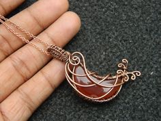 You will receive One Carnelian Moon Pendant Wire Wrapped copper pendant Gemstone Healing Jewelry Filigree Art Wire Wrap Pendant Necklace For Her Beautiful gift . Pendant Size: 43 mm long include bail. Many thanks for you visit my store ♥ if you have any question please contact us. For wholesale Price Please Convo me. You can order different items as many you like . Hand Wrapped Carnelian Necklace For Gifts, Orange Copper Wire Jewelry As A Gift, Crescent Copper Jewelry As Gift, Crescent Copper Jewelry For Gift, Crescent Copper Jewelry Gift, Orange Copper Wire Jewelry For Gifts, Copper Jewelry With Moon Charm For Gift, Unique Crescent Shaped Copper Jewelry, Hand Wrapped Carnelian Pendant Jewelry