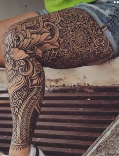 a person with tattoos on their legs