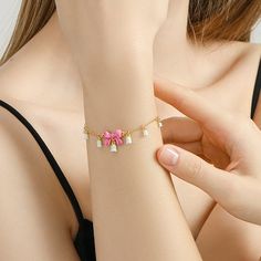 Accessorize with a truly special offering: our Lily Of The Valley Bowknot Bracelet. With its exquisite enamel, it will be sure to draw admiring glances. Exquisite and understated, this bracelet is sure to add an air of sophistication to any outfit. DETAILS Plating: 18k Gold on Brass, Enamel Materials:  18k Gold on Brass Measurements:   Length: 6.10"(15.5cm) + Extender: 2.36"(6.0cm) Weight:  9.5g Adjustable Enamel Charm Bracelet As Gift, Adjustable Enamel Charm Bracelet Gift, Adjustable Enamel Charm Bracelet For Gift, Diamond Star Necklace, Star And Moon Necklace, Lily Of The Valley Flowers, 18k Gold Bracelet, Lucky Bracelet, Diamond Evil Eye