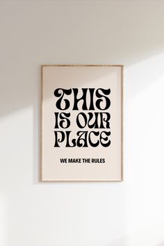 this is our place we make the rules poster in black and white on a wall