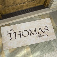 a door mat that says the thomas family on it