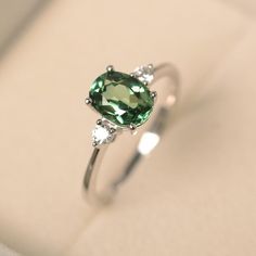 Green sapphire ring sterling silver engagement ring oval | Etsy Green Diamond Ring Silver, Silver Rings With Green Stones, Blue Green Sapphire Engagement Ring White Gold, Green Stone Ring Silver, Silver Green Engagement Ring, Green Diamond Ring Engagement, Sapphire Green Engagement Ring, Silver And Green Wedding Ring, Silver Ring With Green Stone