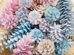 a bunch of fake pine cones sitting on top of a cake covered in frosting