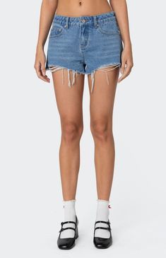 Online only! The Fern Mid Rise Denim Shorts from Edikted combine style and comfort effortlessly. Featuring distressed detailing for a trendy look, these shorts boast a mid-rise waist and are crafted from denim fabric for durability and comfort, making them a versatile addition to your wardrobe.


	Shorts
	Distressed detailing
	Mid rise waist
	Denim fabric
	100% Cotton
	Model wears size S
	Model height is 5'9
	Item care: Machine wash at maximum of 30C, do not bleach, tumble dry low, iron at a maximum of 110C, do not dry clean. Ripped Cotton Jean Shorts For Summer, Summer Cotton Ripped Jean Shorts, Ripped Short Leg Cotton Jeans, Ripped Short Leg Jeans, Ripped Cotton Short Leg Jeans, Ripped Medium Wash Cotton Shorts, Ripped Cutoff Denim Shorts, Ripped Denim Cutoff Shorts, Casual Ripped Cutoff Jean Shorts