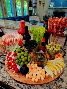 an assortment of fruits and vegetables arranged on a platter