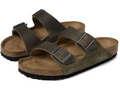 Birkenstock Arizona - Suede/Oiled Leather - Men's Sandals : Thyme : An icon of timeless design and legendary comfort, the Arizona sandal has been defining style since 1973. Upper is made from oiled leather in combination with soft suede. Complete with legendary BIRKENSTOCK design elements, like a contoured cork-latex footbed for the ultimate in support. Suede and oiled leather upper. Unlined. Suede footbed lining helps keep you comfortable. Contoured cork-latex footbed creates custom support with wear. Two adjustable straps with metal pin buckles. Round, open toe silhouette. Heat Warning - Cork footbeds or EVA soles can be damaged by exposure to concentrated heat. Do not leave your footwear in direct sunlight or in closed cars on warm days. If your footwear becomes wet, allow it to air dry Mens Berkinstock, Birkenstock Sandals Men, Men’s Birkenstocks, Birkenstock Suede, Birkenstock Suede Arizona, Dark Brown Birkenstocks, Men Birkenstock, Birkenstock Men, Green Sandals