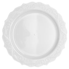 an empty white plate with ornate designs on the rim and bottom, isolated against a white background