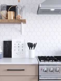 hexagon mosaic tiles in contemporary kitchen with matte black decor and open shelving Hexagon Tiles Kitchen Backsplash, Kitchen Tiles Hexagon, Hexagon White Backsplash, White Hexagon Backsplash Kitchen, Hexagon Tiles Kitchen, Honeycomb Tile Backsplash, Hexagon Backsplash Kitchen, White Hexagon Backsplash, Hexagon Tile Backsplash Kitchen