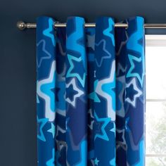 a blue curtain with white stars on it