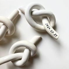 three white links with the words i love you written on one end and two smaller ones attached to each other