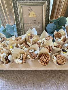 a table topped with lots of different types of snacks