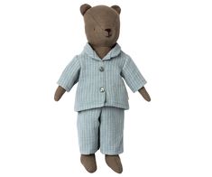 a brown teddy bear wearing pajamas and a blue jacket with buttons on it's chest